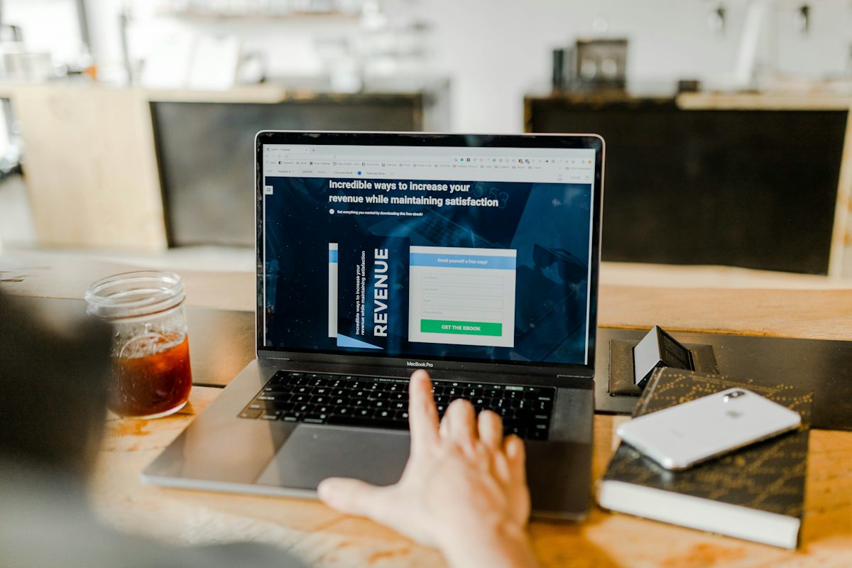 Founder working at a laptop with coffee